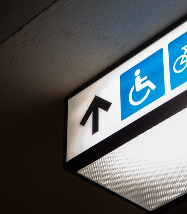 Handicap symbol on overhead sign